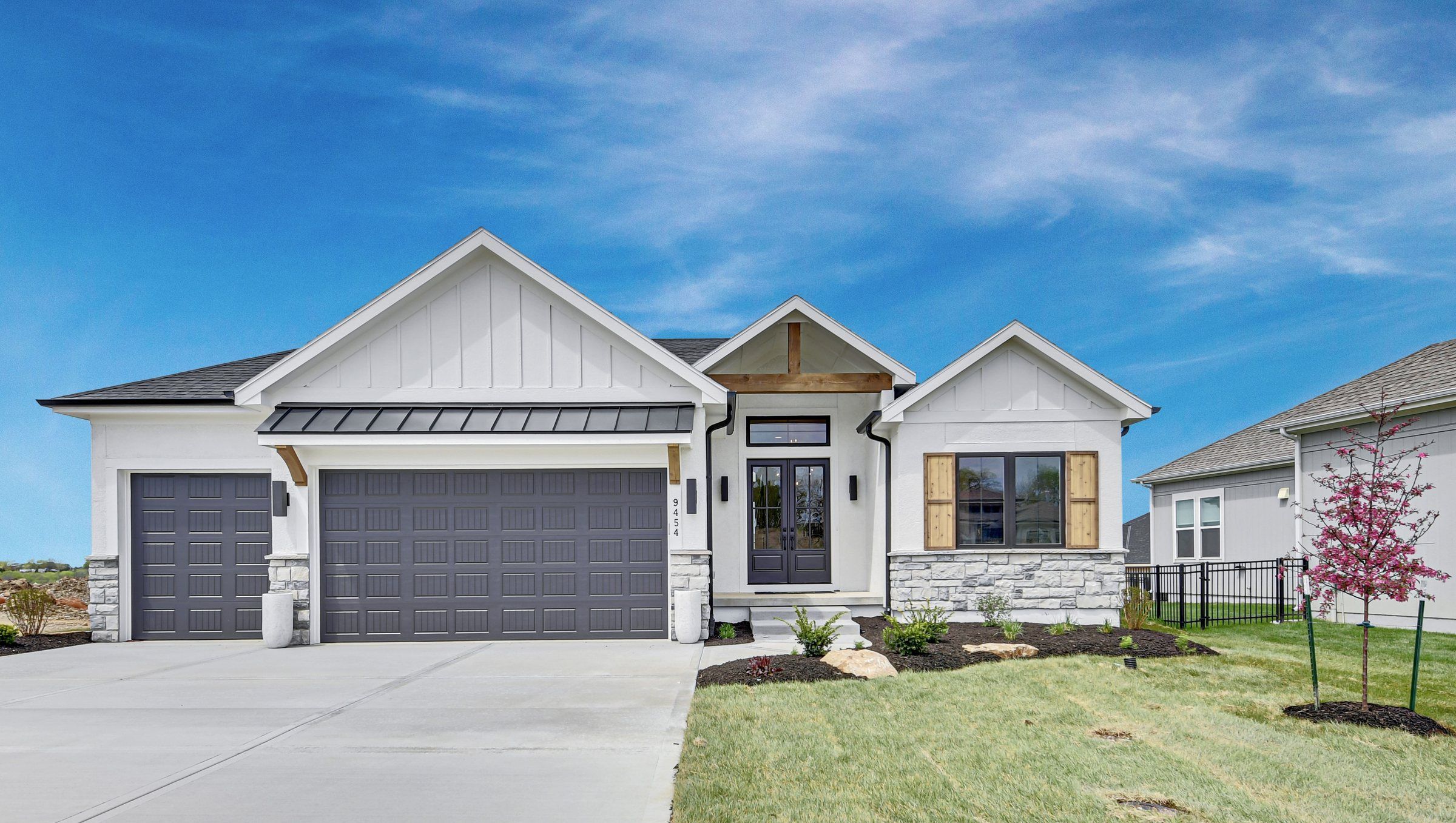 White board-and-batten Bayberry model home by JFE Construction in Heritage Ranch, Olathe