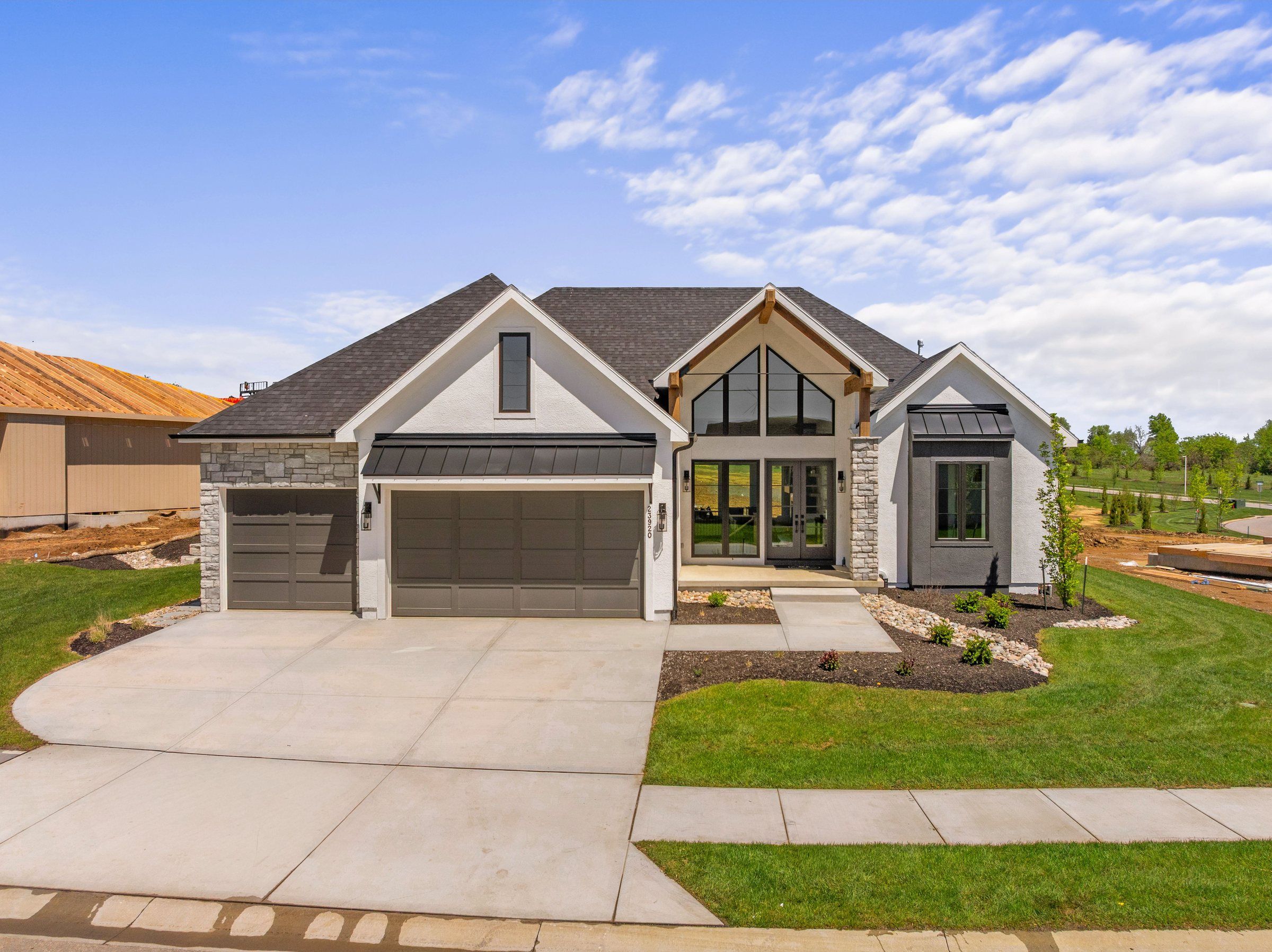Stucco and stone JFE Construction ranch home in Prairie Canyon, Olathe, Kansas